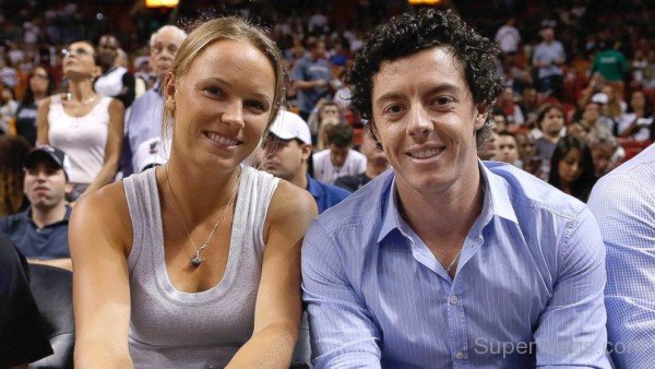 Caroline Wozniacki and Rory McIlroy Watch A Game